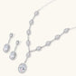 Elegant white gold plated jewelry set with oval cubic zirconia stones in halo settings, featuring Y-necklace and drop earrings.