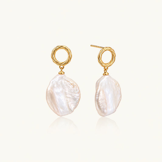 18K gold vermeil twisted circle studs with organic white baroque pearl drops on cream background