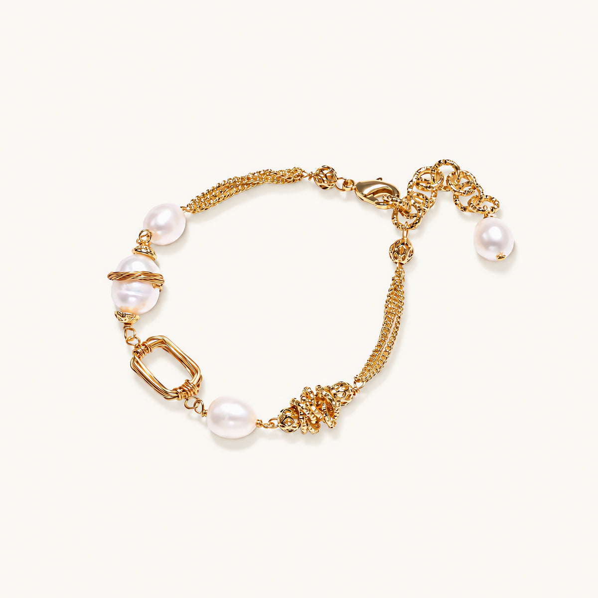 14K gold plated bracelet with freshwater pearls, filigree details, and mixed geometric elements on white background.