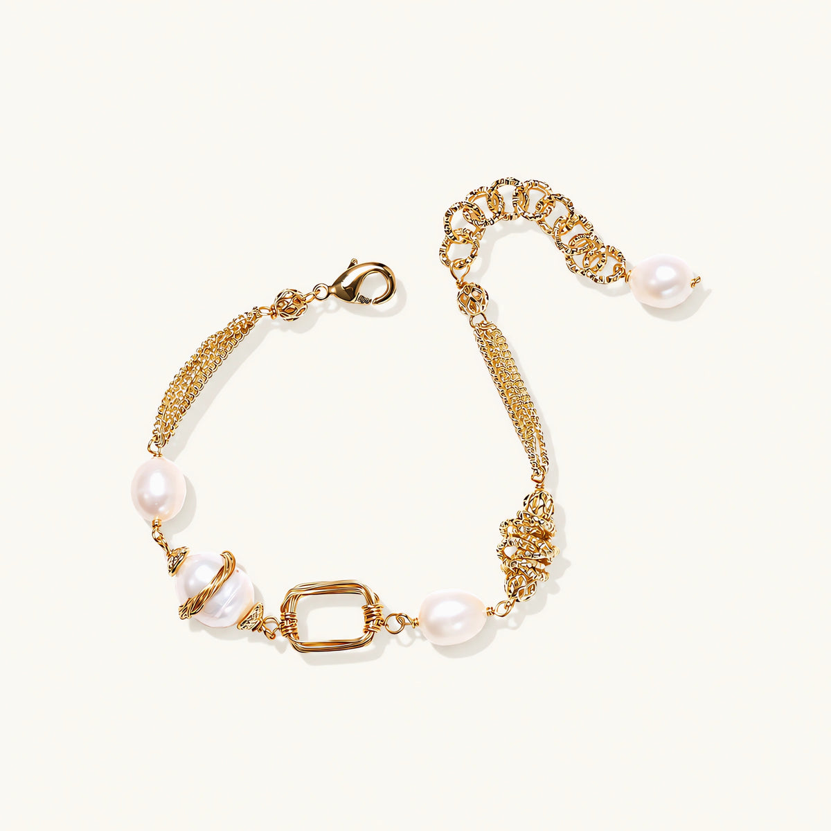 14K gold plated bracelet with freshwater pearls, filigree details, and mixed geometric elements on white background.