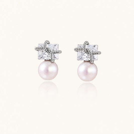 White gold stud earrings with square crystal stones in twisted frames and pink freshwater pearl drops below