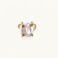 Gold ring with large iridescent baroque pearl and four colored gemstones on textured band