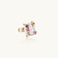 Gold ring with large iridescent baroque pearl and four colored gemstones on textured band